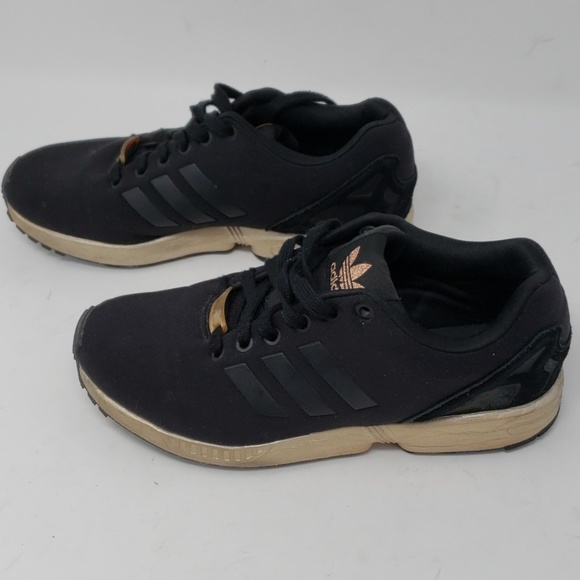 zx flux black metallic gold torsion